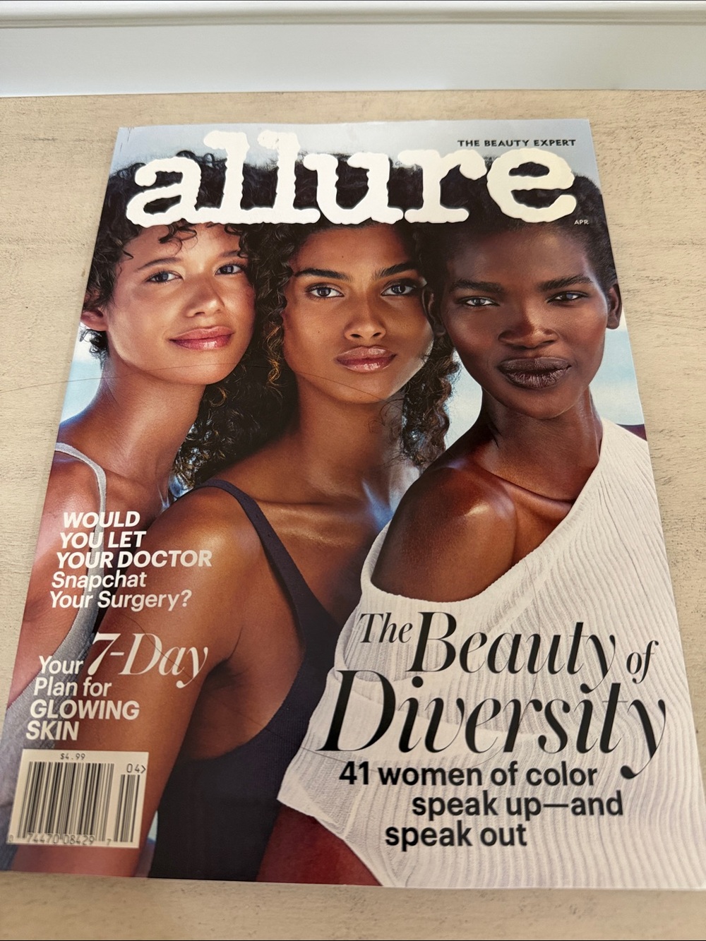 Allure Magazine cover with blue, white, brown tones